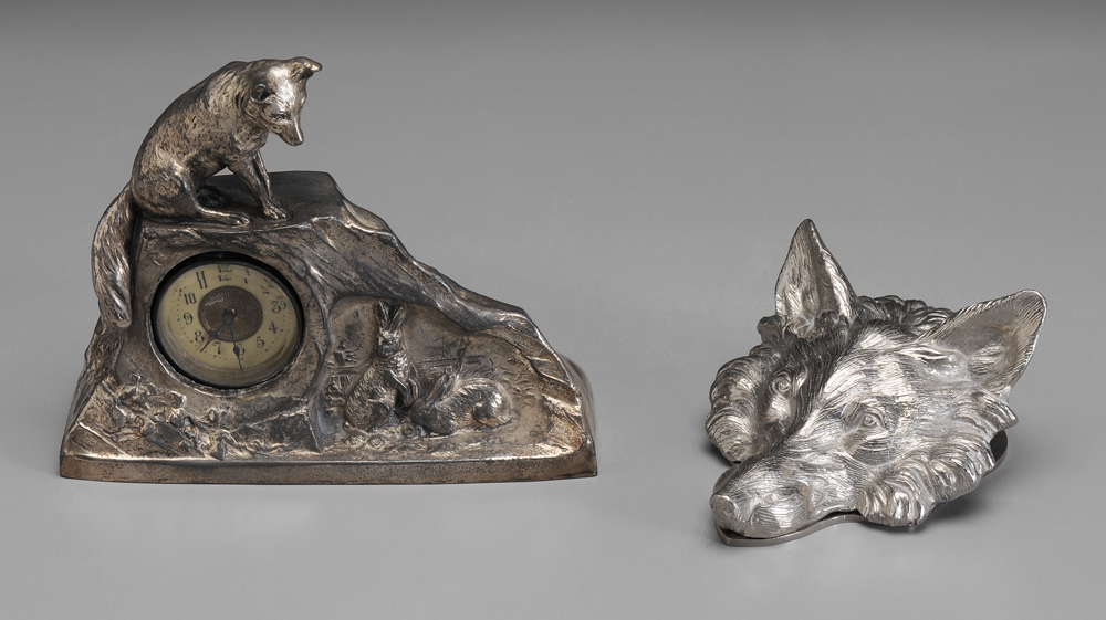 Appraisal: Two Silver-Plated Foxes clock in form of rock with fox