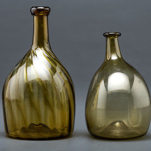 Appraisal: Two Blown Glass Bottles in Olive American th Century Height