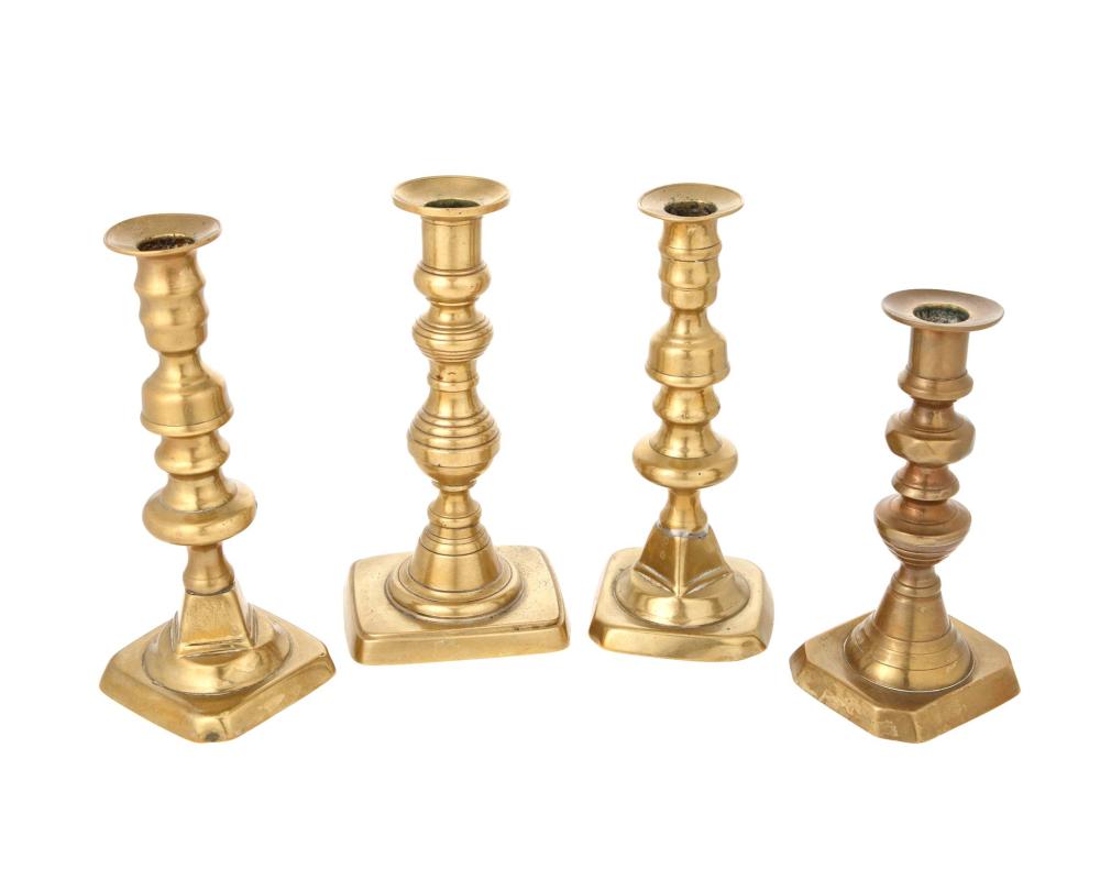 Appraisal: A group of brass candlesticks Early th century Comprising a