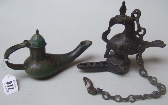 Appraisal: Two Eastern oil lamps cruse one in the form of