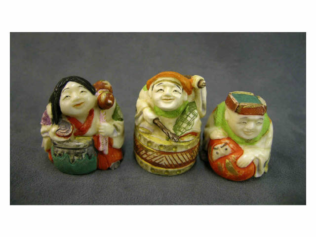 Appraisal: Three polychromed netsukes including woman with a gourd and a