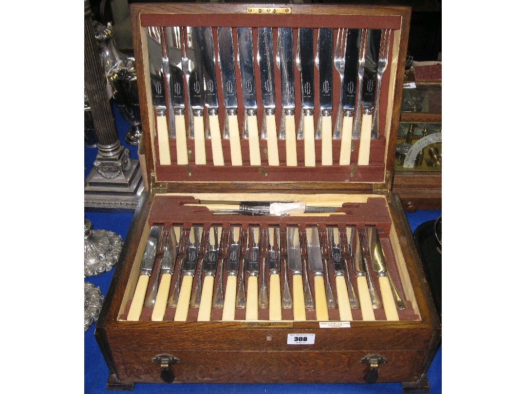 Appraisal: Part set of cutlery in oak canteen piece approx