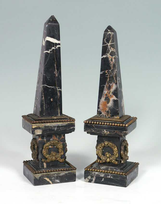 Appraisal: PAIR BLACK MARBLE OBELISK One being slightly taller than the