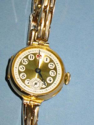 Appraisal: A LADY'S SWISS WRIST WATCH with gold finish circular dial