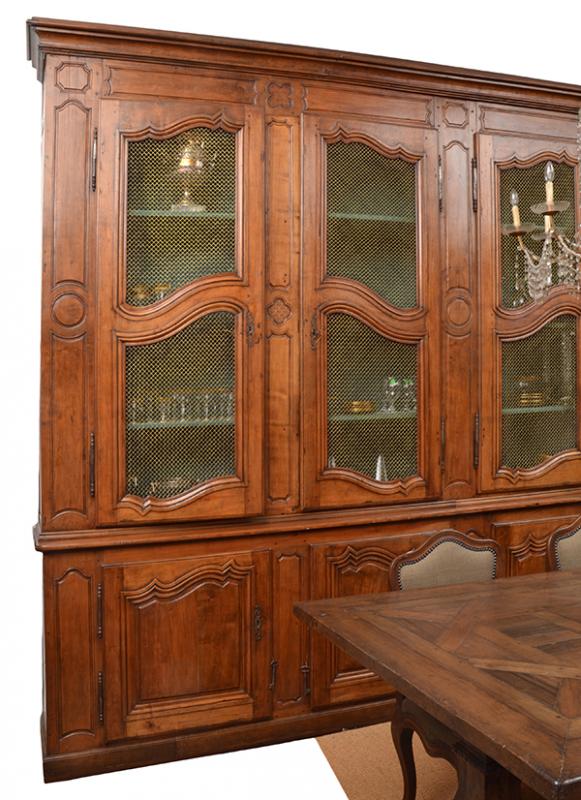 Appraisal: AN IMPRESSIVE FRENCH WALNUT BOOKCASE with a stepped cornice above