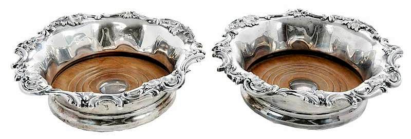 Appraisal: Pair English Silver Coasters Sheffield scroll and foliate decoration wooden