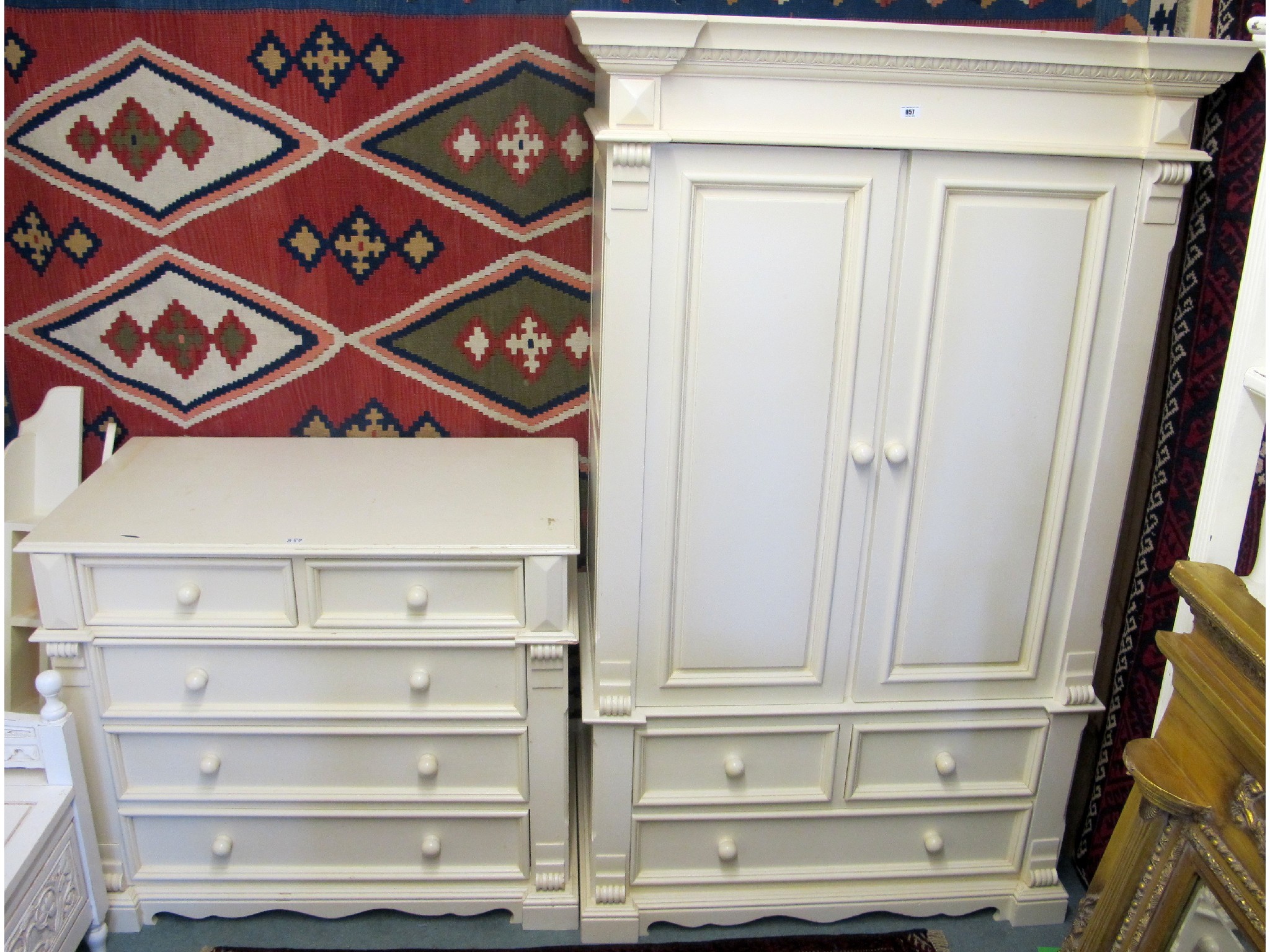 Appraisal: A contemporary cream two over three chest of drawers and