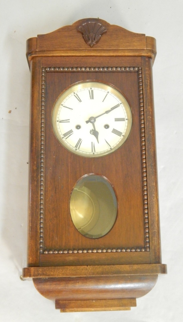 Appraisal: An early thC stained beech wall clock with a paper