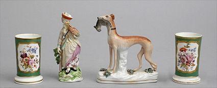 Appraisal: PAIR OF ENGLISH PORCELAIN SPILL VASES A FIGURE OF A