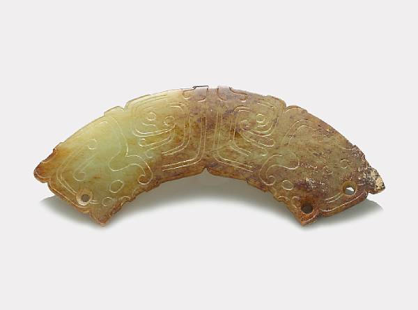 Appraisal: A nephrite huang Of Eastern Zhou Dynasty style the gently