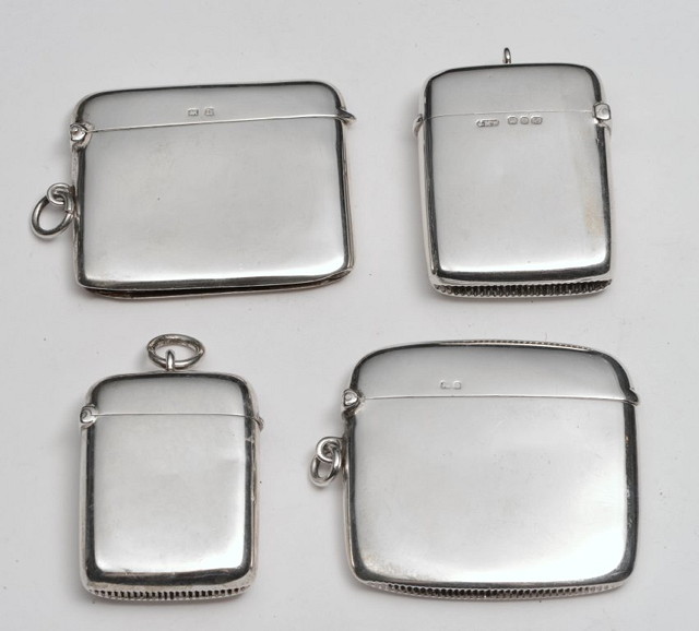 Appraisal: A COLLECTION OF FOUR SILVER VESTA CASES of plain form