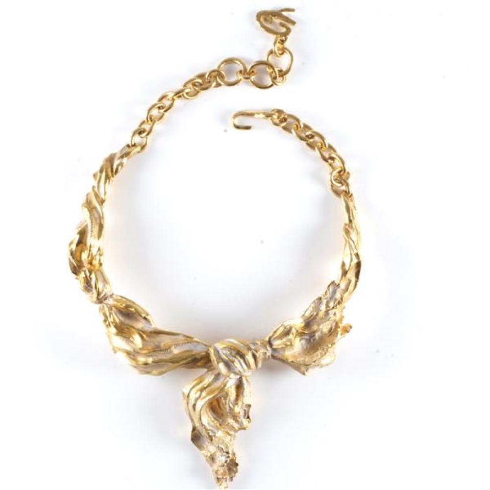 Appraisal: CHRISTIAN LACROIX GOLD BOW COLLAR NECKLACE Christian Lacroix gold bow