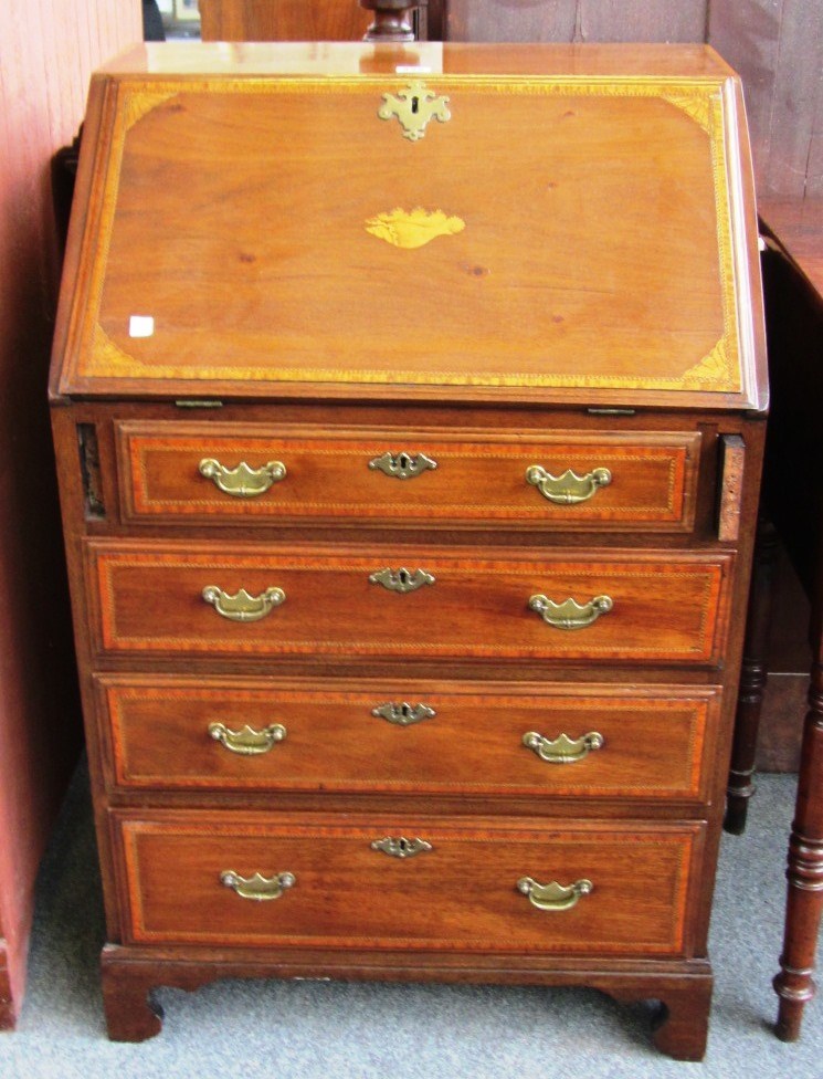 Appraisal: An Edwardian marquetry inlaid mahogany bureau of small proportions with