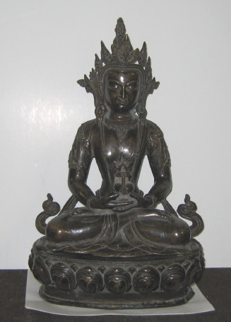 Appraisal: CHINESE CAST BRONZE BUDDHA Seated raised on lotus base Height