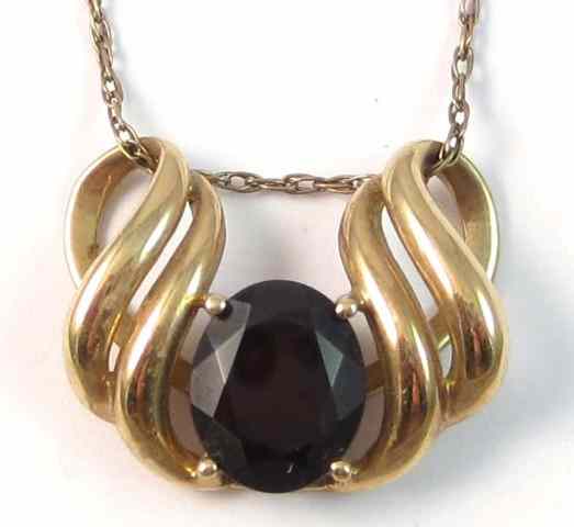 Appraisal: GARNET AND TEN KARAT GOLD PENDANT NECKLACE the pendant is