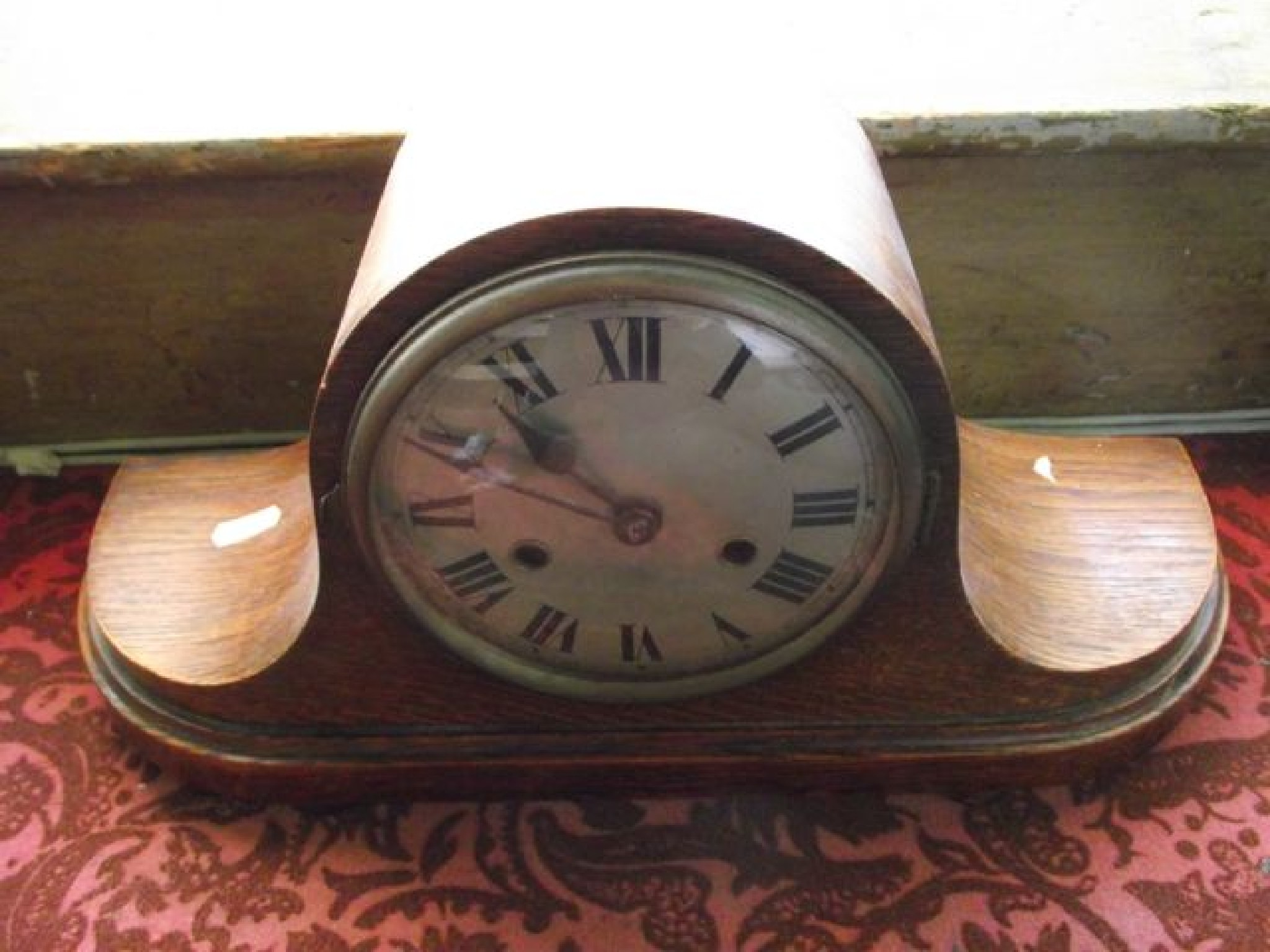 Appraisal: An oak top hat clock with -day striking movement