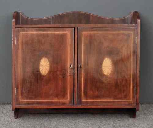 Appraisal: An Edwardian mahogany rectangular medicine cabinet inlaid with boxwood stringings