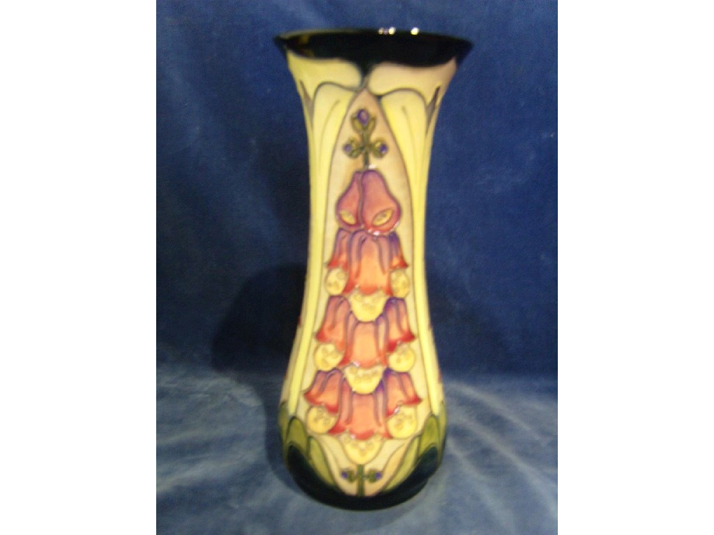 Appraisal: A tall Moorcroft vase with flared neck and painted and