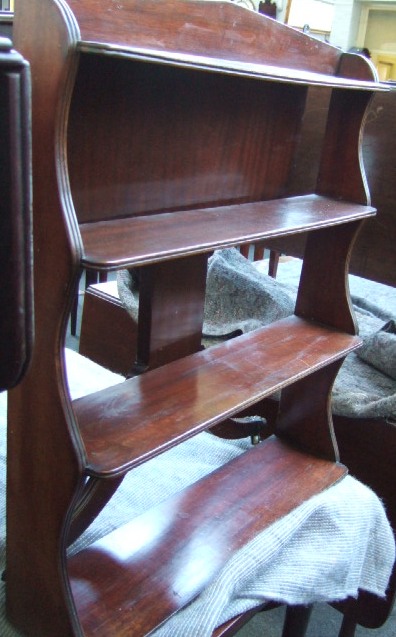 Appraisal: A set of mahogany hanging four tier open wall shelves