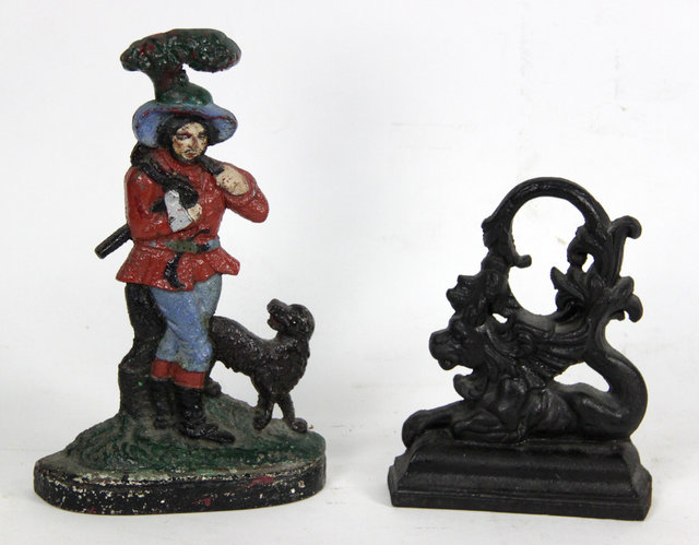 Appraisal: A cast iron door stop woodsman and hound cm high