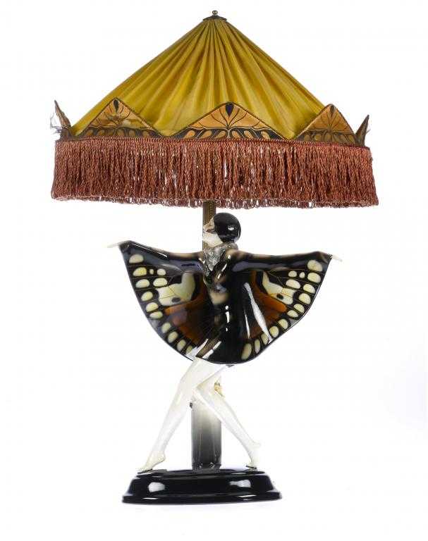 Appraisal: THE CAPTURED BIRD A GOLDSCHEIDER EARTHENWARE FIGURAL LAMP MODELLED BY