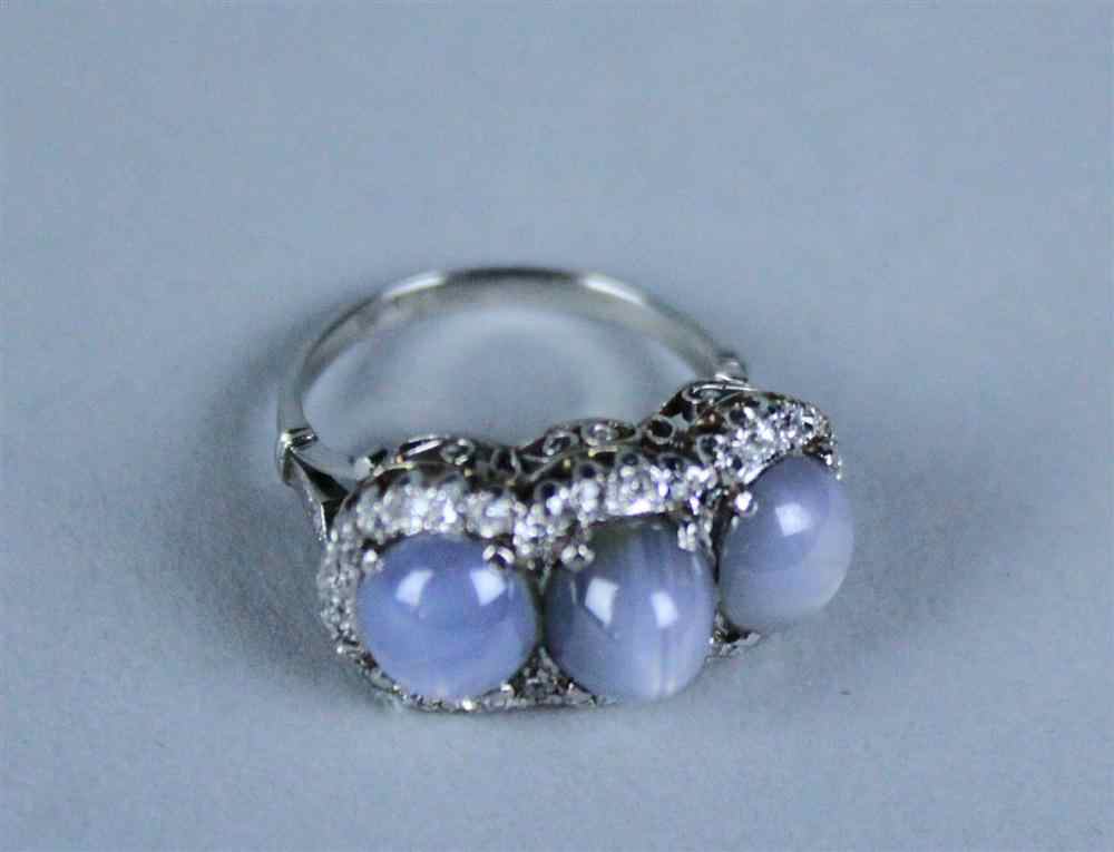 Appraisal: LADY'S THREE-STONE STAR SAPPHIRE AND DIAMOND RING the delicately cast