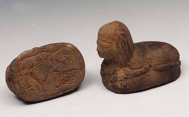 Appraisal: TWO EGYPTIAN POTTERY SEALS each in the form of half