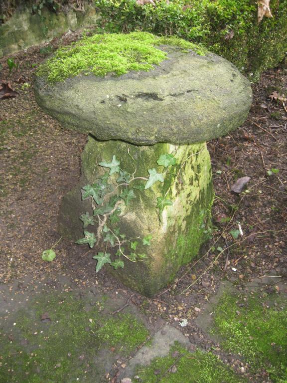 Appraisal: An old sandstone circular Staddle Stone on square tapering base