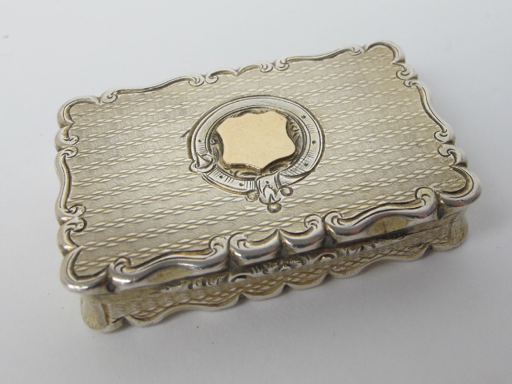 Appraisal: A Victorian silver gilt vinaigrette of shaped rectangular form with