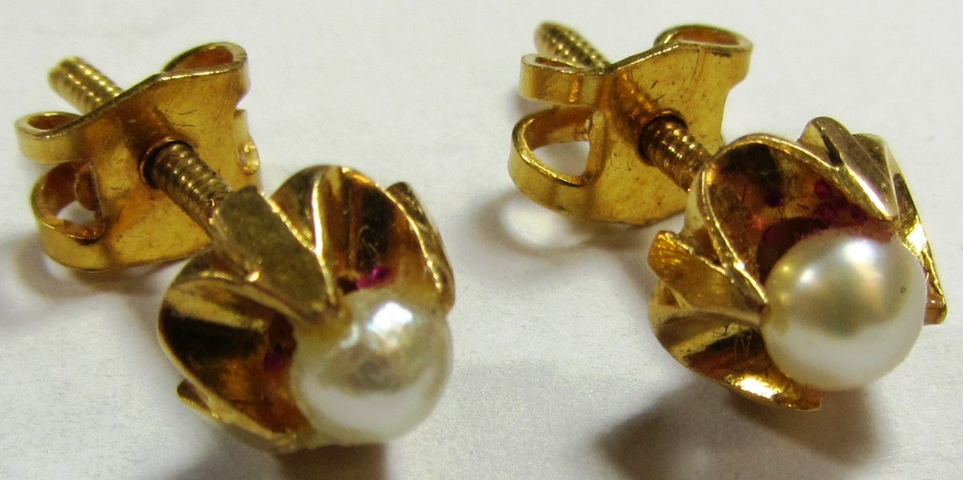 Appraisal: A pair of gold and cultured pearl mounted solitaire earrings