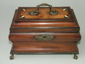 Appraisal: A mahogany and inlaid bombe tea caddy th century the