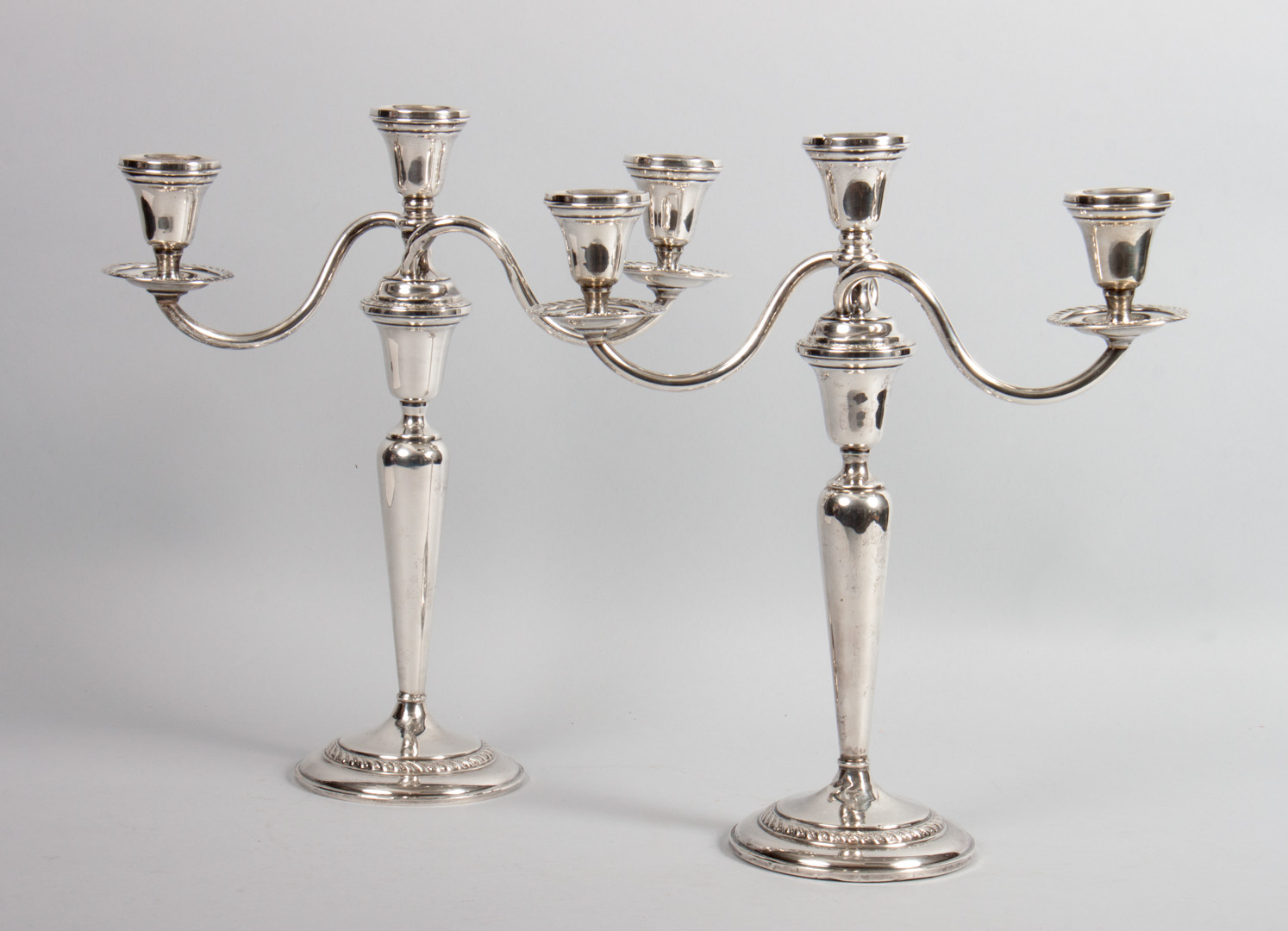 Appraisal: Pair of Preisner weighted-sterling candelabra three-light candelabra in H