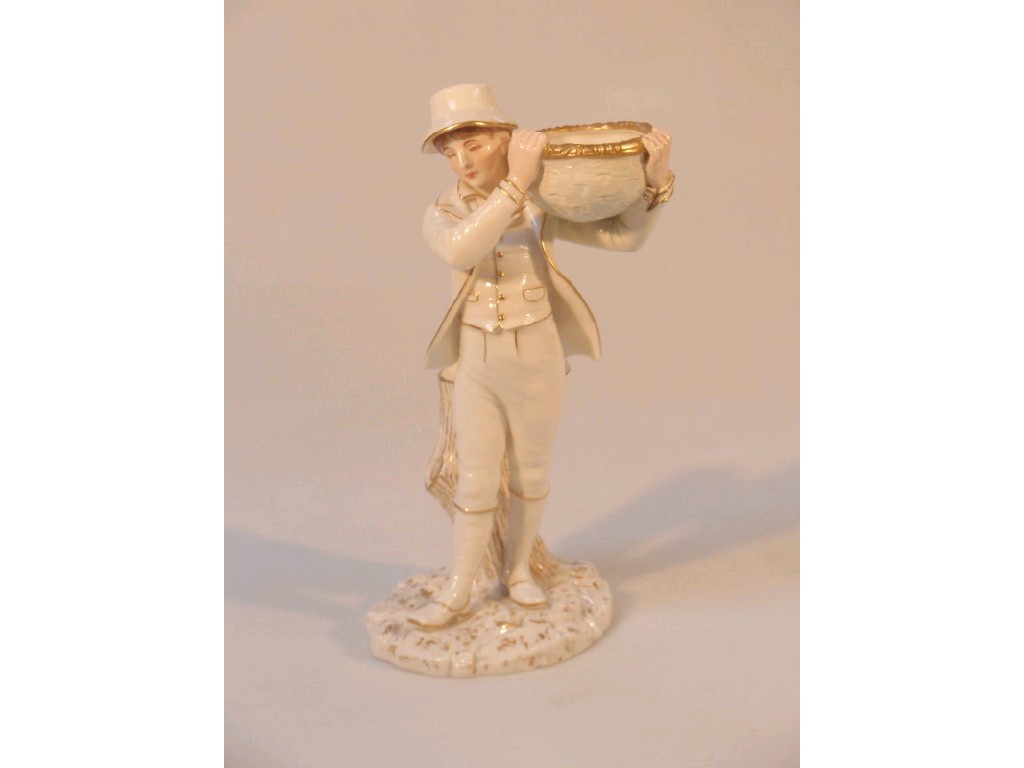 Appraisal: A Royal Worcester 'ivory' porcelain figure of a standing boy