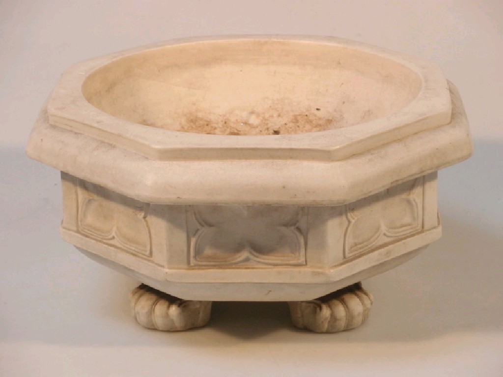 Appraisal: A stoneware table top font with hexagonal moulded border and