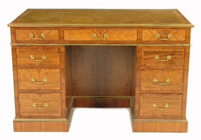 Appraisal: A rosewood and kingwood kneehole desk with brass mounts the