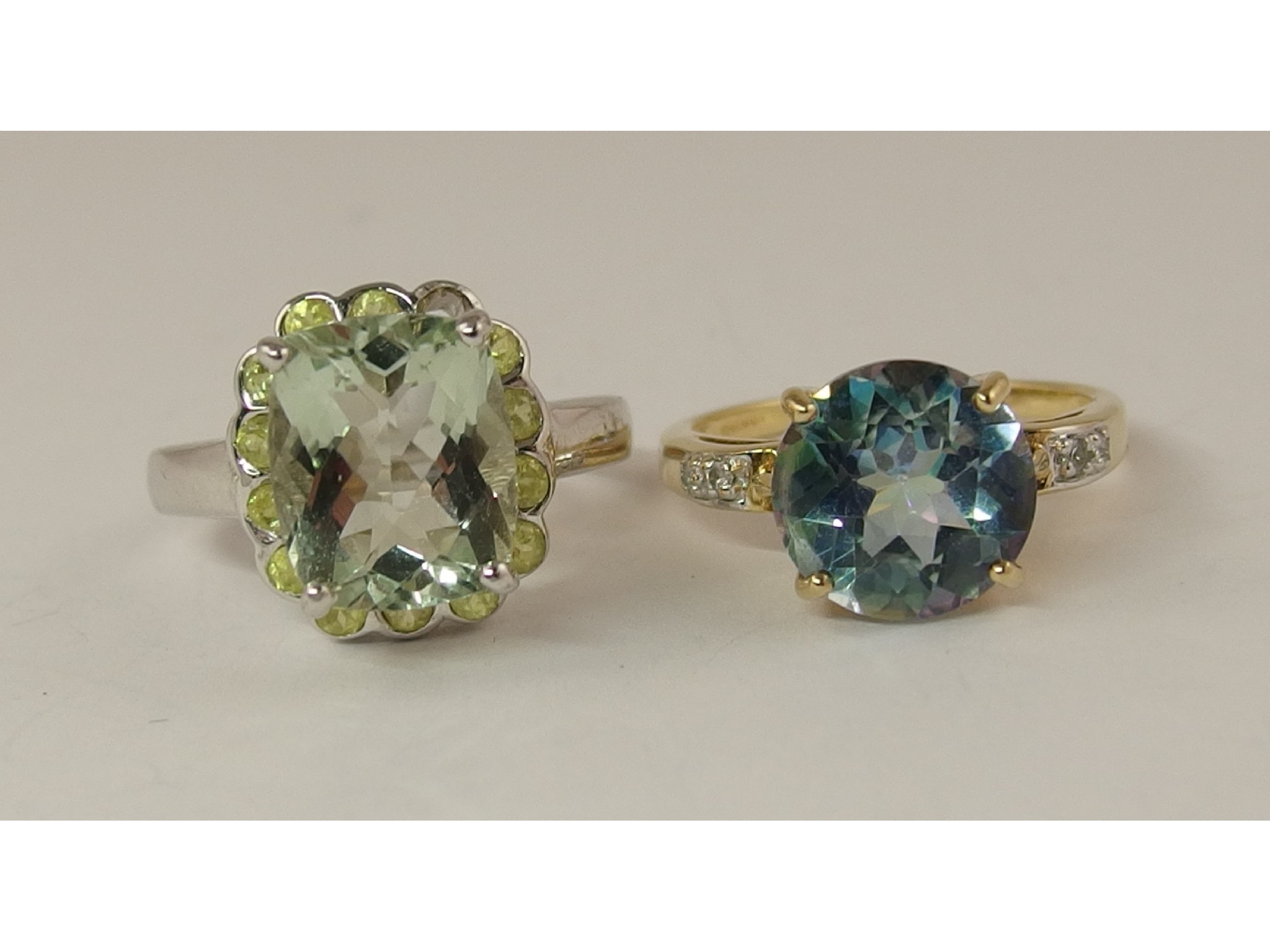 Appraisal: A ct Neptune topaz ring and a ct green amethyst