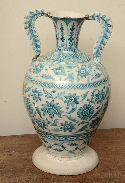 Appraisal: A TURKISH ISNIK TWO HANDLED URN SHAPED VASE with turquoise