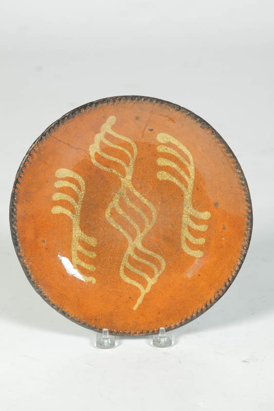 Appraisal: REDWARE PIE PLATE American mid th century Coggled rim and