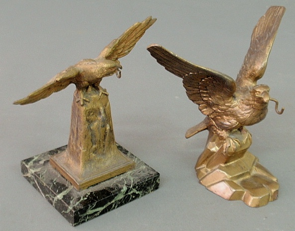 Appraisal: - Two bronze decorated pot metal spread winged-eagle form watch