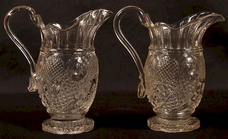 Appraisal: Two Colorless Flint Glass Cream Pitchers Two Colorless Flint Glass