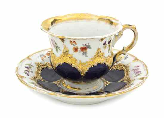 Appraisal: A Meissen Porcelain Cup and Saucer with polychrome floral decoration