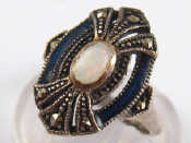 Appraisal: An unusual white metal tests silver opal and blue enamel