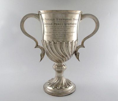 Appraisal: A presentation silver two-handled trophy cup circular form part fluted