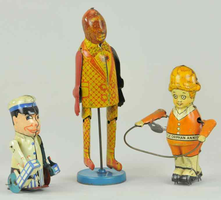 Appraisal: LOT OF THREE TIN FIGURE TOYS Grouping includes Milkman Delivery