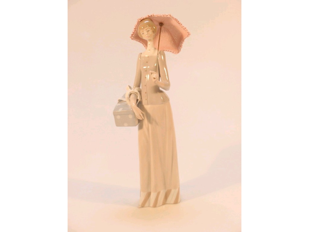 Appraisal: A Lladro figure of a young woman with a pink