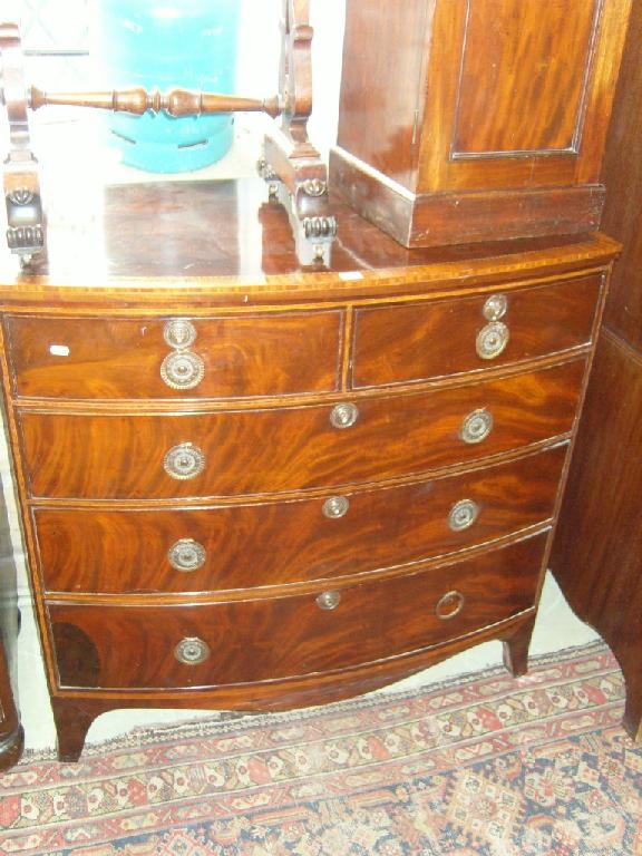 Appraisal: A Georgian mahogany bow front chest of long and short