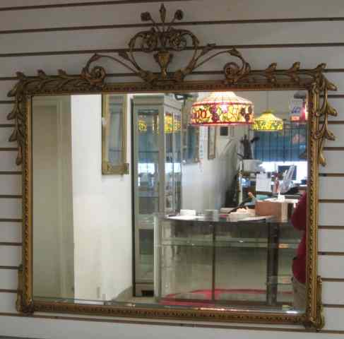 Appraisal: AN AMERICAN GILT WOOD WALL MIRROR having vasiform and floral