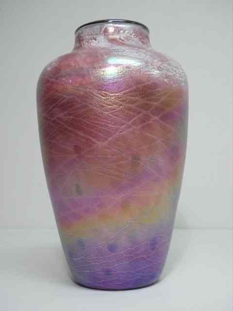 Appraisal: A pink iridescent cased art glass vase with a threaded