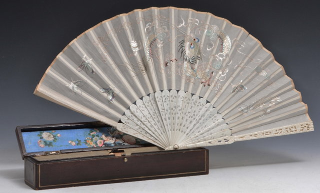 Appraisal: A CHINESE CANTON CARVED IVORY FAN with silk panel embroidered