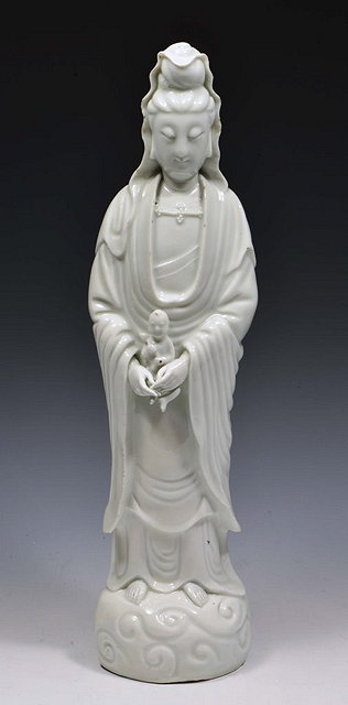 Appraisal: A CHINESE BLANC DE CHINE MODEL OF GUANYIN holding a